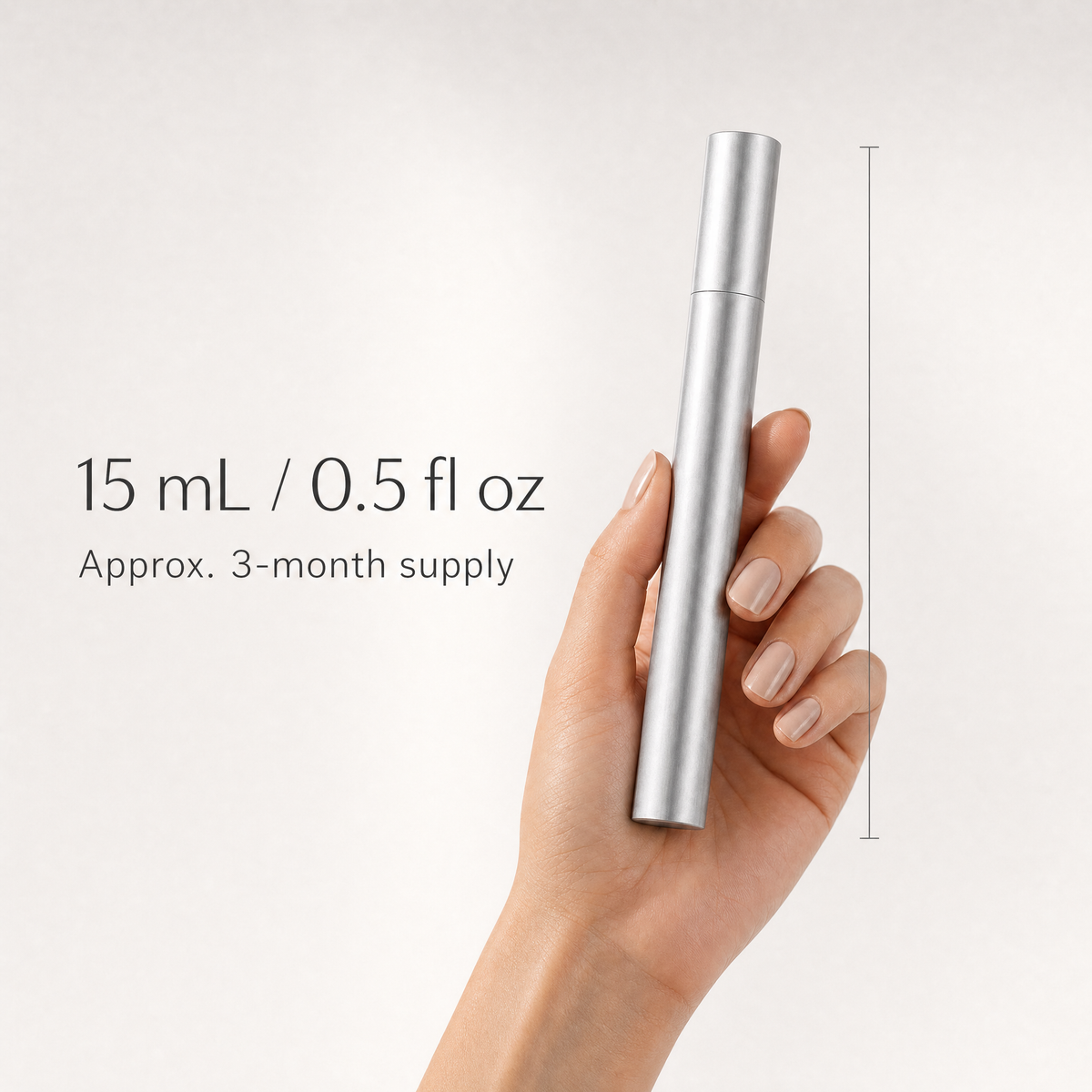 Hand holding the 15 mL lash serum tube, approx. 3-month supply