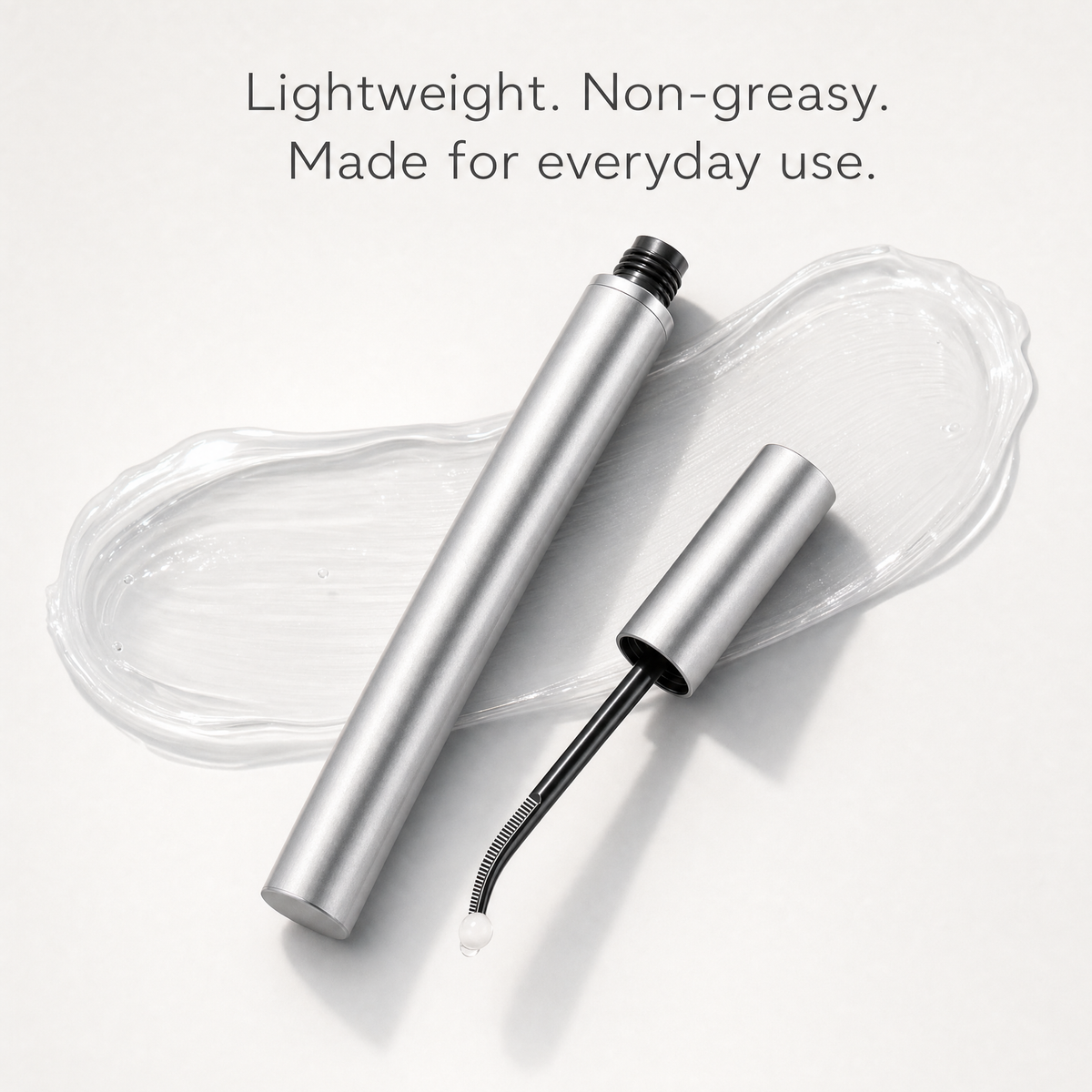 Lightweight, non-greasy clear serum texture beside the tube